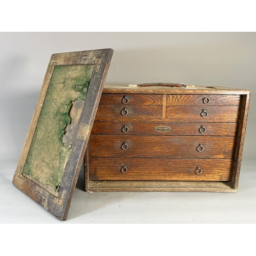 825 - A 1940s Fearcleve Products of Cheltenham oak cased seven drawer engineer's tool chest containing a l... 