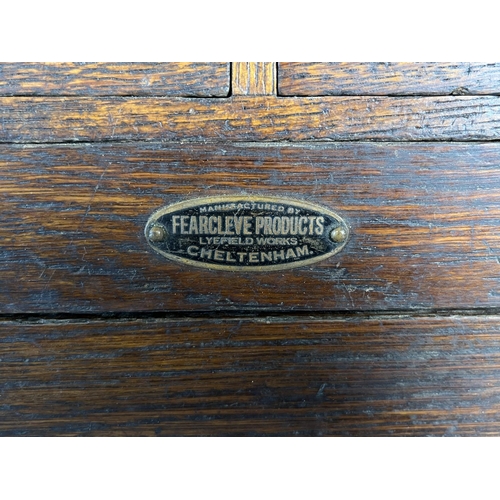 825 - A 1940s Fearcleve Products of Cheltenham oak cased seven drawer engineer's tool chest containing a l... 