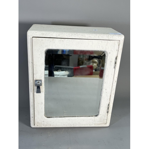 826 - A mid 20th century white painted wooden bathroom cabinet with bevelled edge mirror and internal glaz... 