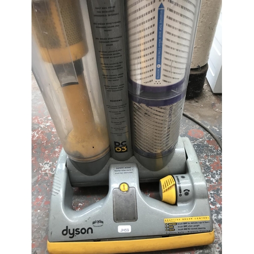 1568 - A Dyson DC03 Dual Cyclone upright bagless vacuum cleaner