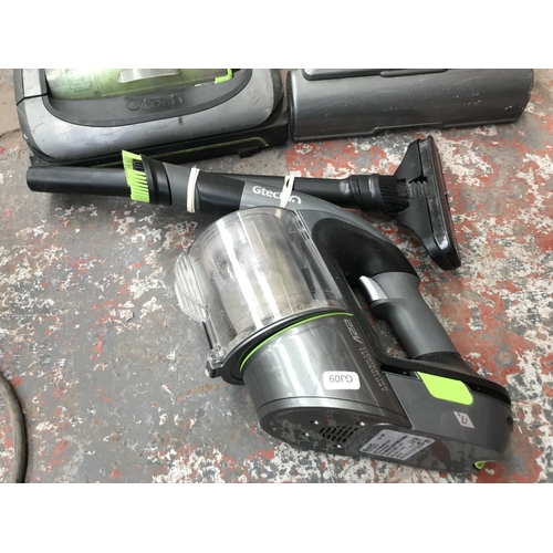 1569 - Three Gtech items, one ATF handheld bagless vacuum cleaner and two Air Ram upright vacuum cleaners