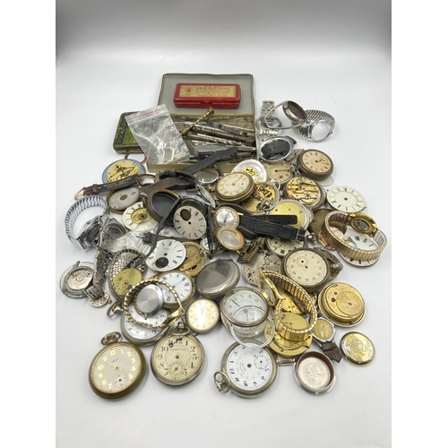 725 - A collection of vintage watch makers accessories to include movements, parts, cases etc.