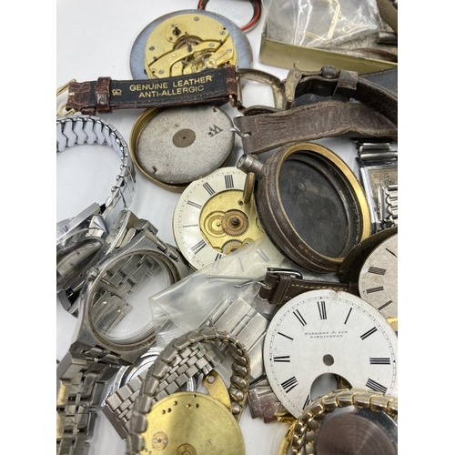 725 - A collection of vintage watch makers accessories to include movements, parts, cases etc.