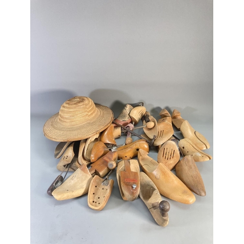 810A - A large collection of vintage wooden shoe lasts and stretchers