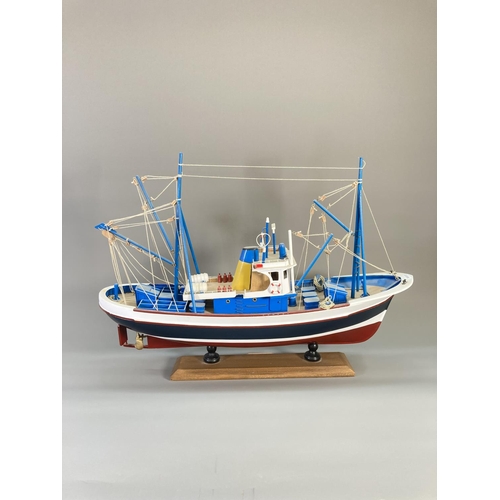 837 - A hand-painted wooden model fishing boat titled Nueva Estrella - approx. 44cm high x 62cm long x 17c... 