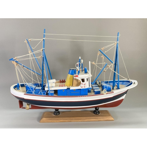 837 - A hand-painted wooden model fishing boat titled Nueva Estrella - approx. 44cm high x 62cm long x 17c... 