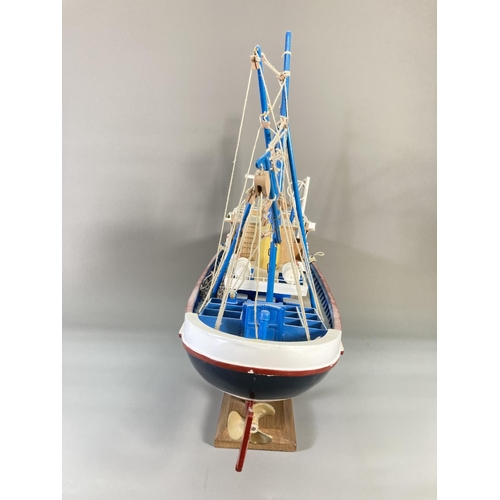 837 - A hand-painted wooden model fishing boat titled Nueva Estrella - approx. 44cm high x 62cm long x 17c... 