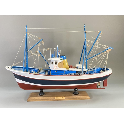 837 - A hand-painted wooden model fishing boat titled Nueva Estrella - approx. 44cm high x 62cm long x 17c... 