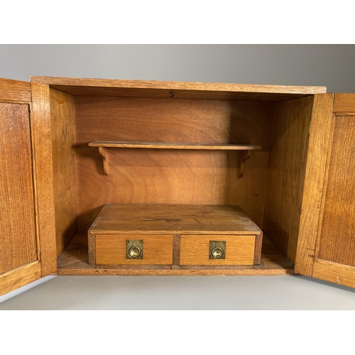 846 - A mid 20th century oak smokers cabinet with two internal drawers and shelf - approx. 36cm high x 51c... 