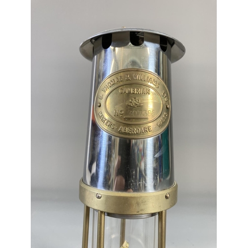 848 - A reproduction E. Thomas & Williams Ltd. brass miners lamp - approx. 24.5cm high