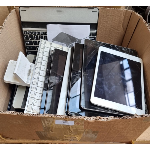 1497 - A box containing a collection of tablet keyboards and Apple tablets for spares or repairs