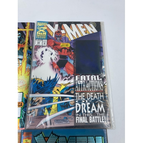 774 - Four Marvel X-Men comics, three with chromium covers - Alpha, Omega, Prime and one Anniversary Issue... 