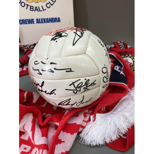 790 - A collection of Crewe Alexandra football memorabilia to include three signed footballs, five scarves... 