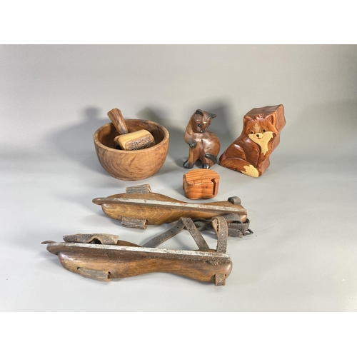 856 - A collection of assorted treenware to include nutcracker, 17cm bowl, cat ornament etc.