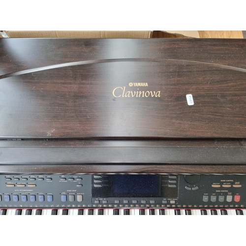 1391 - A Yamaha Clavinova CVP-105 digital piano with matching stool