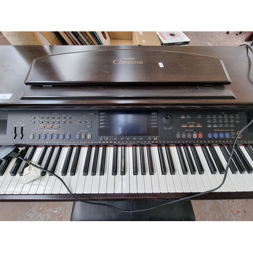 1391 - A Yamaha Clavinova CVP-105 digital piano with matching stool