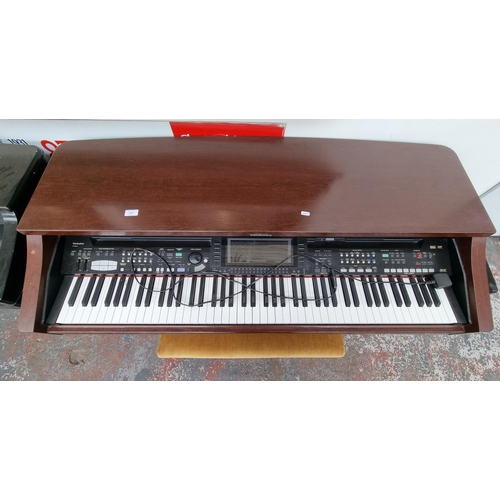 1393 - A Technics SX-PR804 electric piano with matching stool