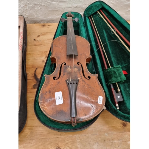 1395 - Three items, one vintage full size violin, one half size violin case containing two bows and one cas... 