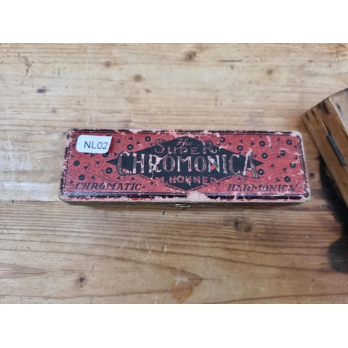 1399 - Three vintage Hohner harmonicas, one boxed The Super Chromonica (key of C), one wooden cased The Chr... 