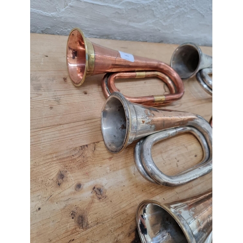 1401 - Seven bugles to include brass and copper, silver plated and brass