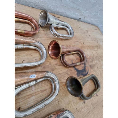 1401 - Seven bugles to include brass and copper, silver plated and brass