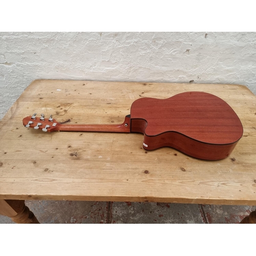 1407 - A Crafter HTC--24EQ/TS steel strung electro acoustic guitar with cutaway and fitted C4T pre-amp/tune... 