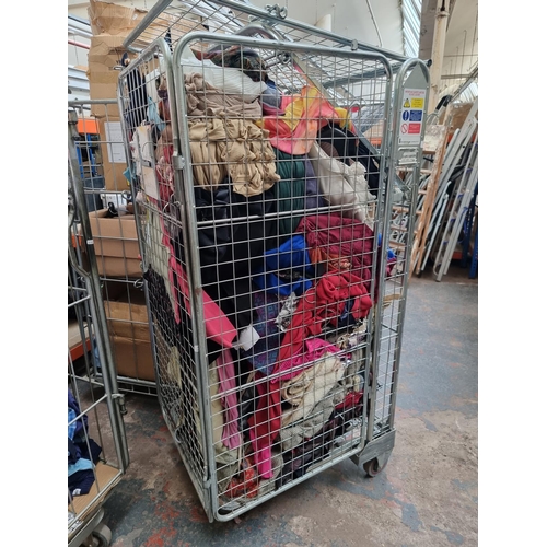 1719D - A large quantity of assorted clothing (cage not included)