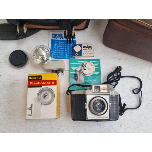 1253 - Three items, one cased Minolta Dynax 500si 35mm SLR camera fitted with Cosina 1:3.5-5.6 Ø72 28-210mm... 