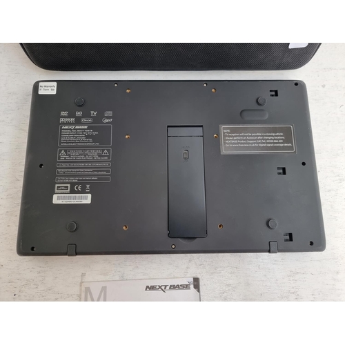 1427 - A cased Next Base SDV1102-B tablet DVD player