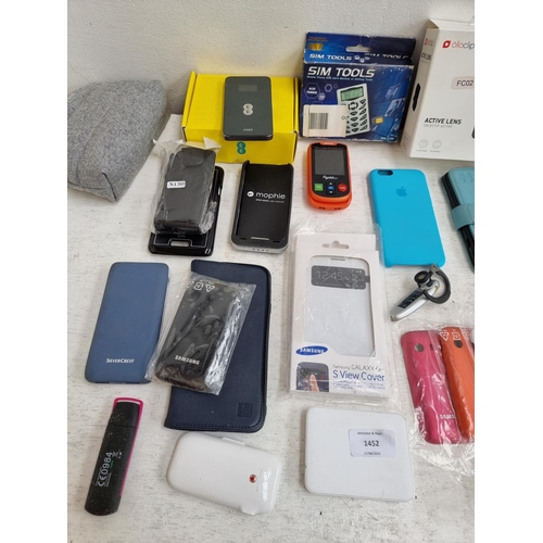 1452 - A collection of mobile phone accessories to include Olloclip active lense camera, power banks, boxed... 