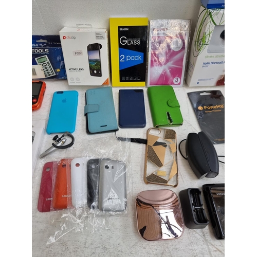 1452 - A collection of mobile phone accessories to include Olloclip active lense camera, power banks, boxed... 