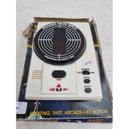 1481 - A boxed vintage Grandstand Leisure Products Invader From Space handheld electronic game