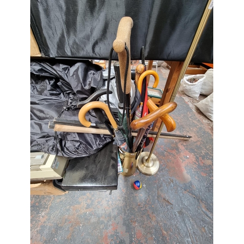 1719 - A large collection of assorted house clearance items to include brass umbrella stand with lions head... 