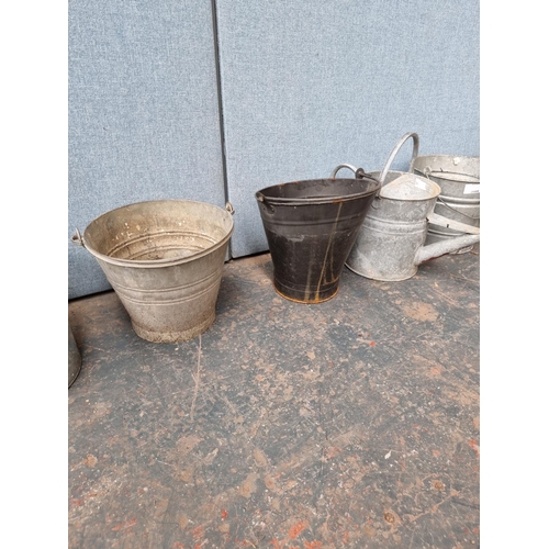 1683 - A collection of galvanised buckets and one watering can