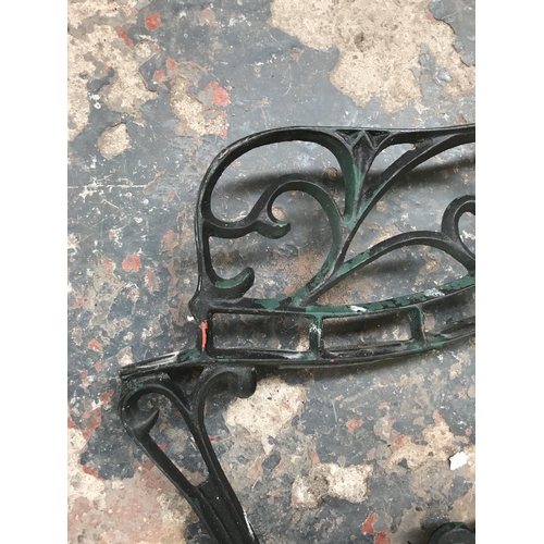 1688 - A pair of cast iron bench ends