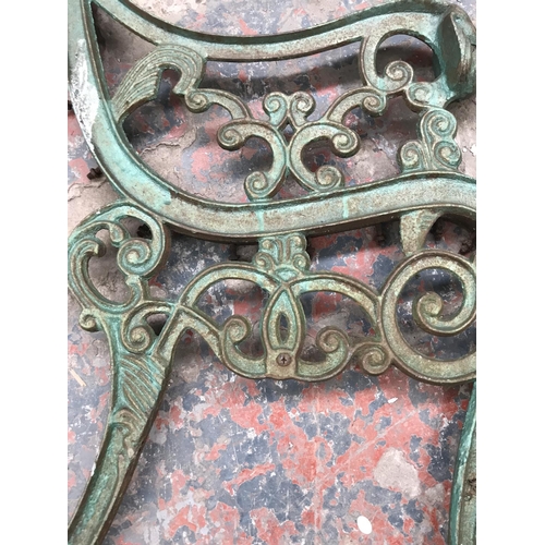 1689 - A pair of cast iron bench ends