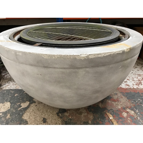 1690A - A fibre glass circular fire pit