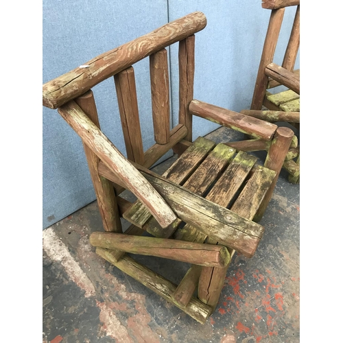 1694 - A pair of pine garden chairs - approx. 92cm high x 79cm long x 57cm deep