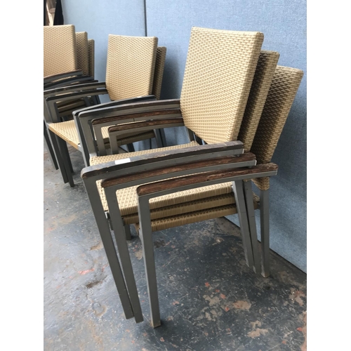 1701 - A collection of eight rattan effect garden chairs