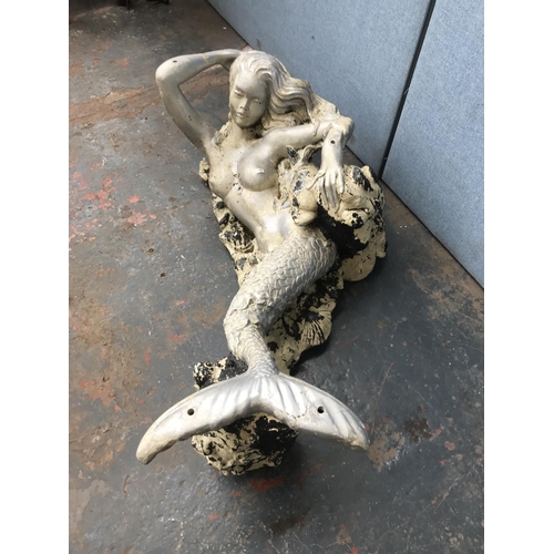 1702 - A fibre glass mermaid statuette - approx. 40cm high x 114cm long x 46cm deep