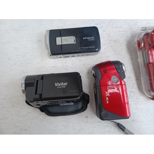 1263 - A collection of digital camcorders to include boxed and sealed Bell & Howell DV30HD, Vivitar DVR510N... 