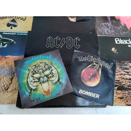 1330 - A collection of rock vinyl records to include Motorhead, Kiss, AC/DC, Black Sabbath, Hawkwind etc.