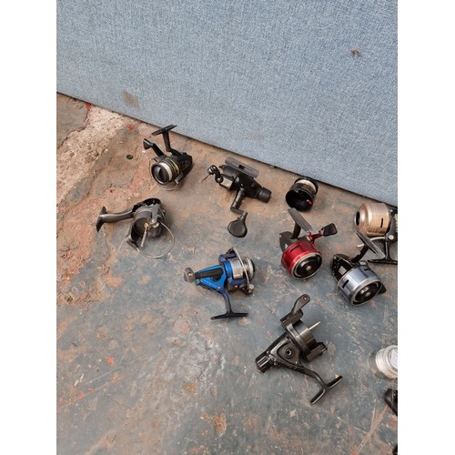 1632A - A collection of assorted fishing reels to include Abu 505 closed face, Intrepid Cresta with front dr... 