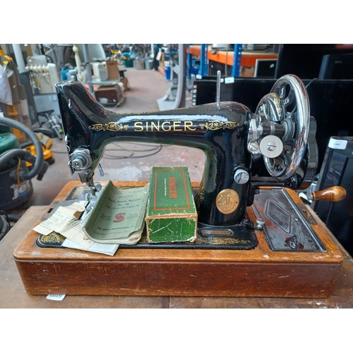 1532 - Two items, one cased Singer number 99 hand crank sewing machine with instruction manual and boxed ac... 