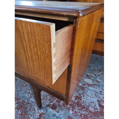 1065A - A 1960s Homeworthy teak three piece bedroom suite comprising double wardrobe, chest of six drawers a... 