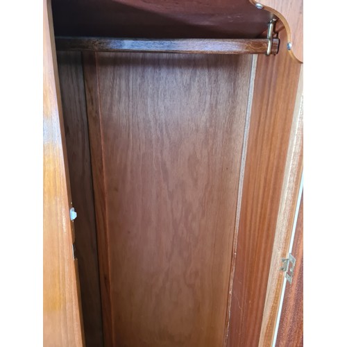 1065A - A 1960s Homeworthy teak three piece bedroom suite comprising double wardrobe, chest of six drawers a... 