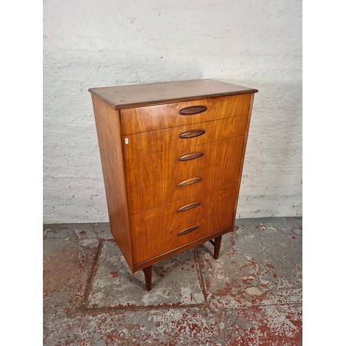 1065A - A 1960s Homeworthy teak three piece bedroom suite comprising double wardrobe, chest of six drawers a... 