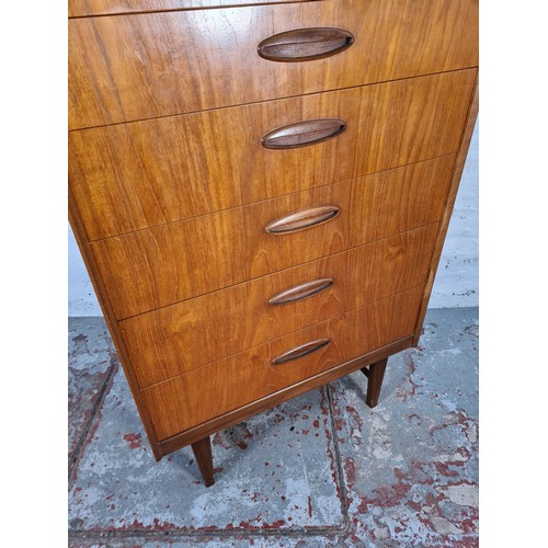 1065A - A 1960s Homeworthy teak three piece bedroom suite comprising double wardrobe, chest of six drawers a... 