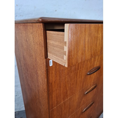 1065A - A 1960s Homeworthy teak three piece bedroom suite comprising double wardrobe, chest of six drawers a... 