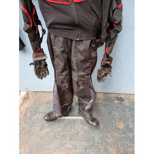 1630A - A selection of motorcycle clothing to include Wolf leather trousers and jacket - size 42, HJC IS.17 ... 